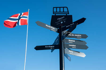 Signpost with directions to world cities at the top of Floyen mountain in Norwayの写真素材