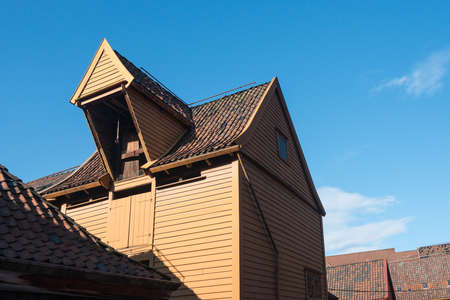 Crane on roof of  warehouses in Bryggen district in the center of Bergen, Norway