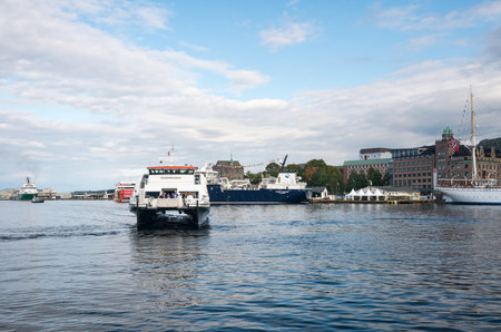 BERGEN, NORWAY - 23 SEPTEMBER, 2017: Norled express passenger ferry enters Bergen harborのeditorial素材