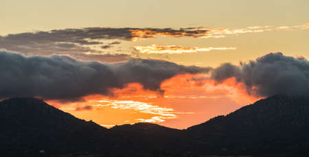 Sun setting behind mountains near to Ramona in the deserts of southern california
