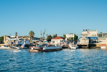 NEWPORT BEACH, CALIFORNIA - 4 NOVEMBER 2017: Tourists and vehicles on car ferry to Balboa Island, Newport Beach in Californiaのeditorial素材