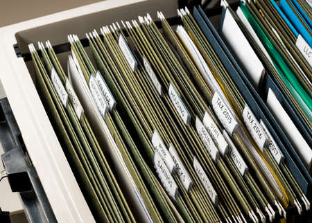 Close up of a well organized home filing system with tabs for each subject