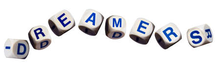 Dreamers children spelling letters on white background to illustrate dreaming of the future
