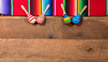 Cinco de Mayo background image on with maracas and serape on wooden rustic boardsの写真素材