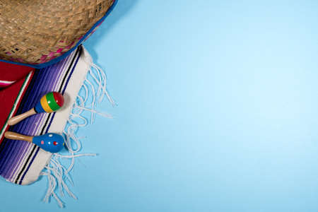 Cinco de Mayo background image on with maracas and sombrero on blue layerの写真素材