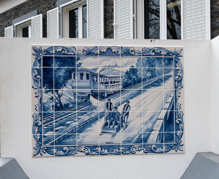 FUNCHAL, MADIERA - MARCH 12, 2018: Tiles illustrating Carro do Monte basket sled ride in Funchal on island of Madieraのeditorial素材