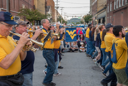 MORGANTOWN, WV - 5 OCTOBER 2018: Homecoming parade down Main Street of Morgantown with Alumni...
