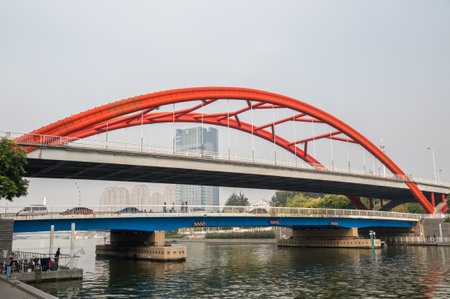 TIANJIN, CHINA - 21 OCTOBER 2018: Jingang Bridge and Tientsin Eye Ferris wheel in Tianjinのeditorial素材