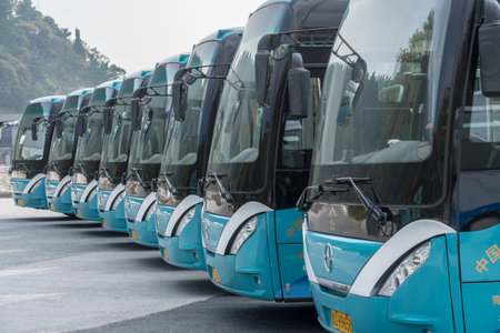 QINGDAO, CHINA - 24 OCTOBER 2018: Tour buses lined up at Laoshan near Qingdao Chinaのeditorial素材
