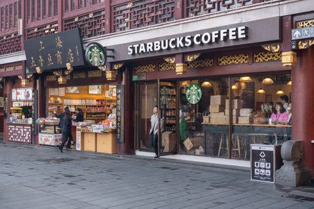 SHANGHAI - CHINA - 26 OCTOBER 2018: Entrance to mall of shops on with Starbucks in old townのeditorial素材