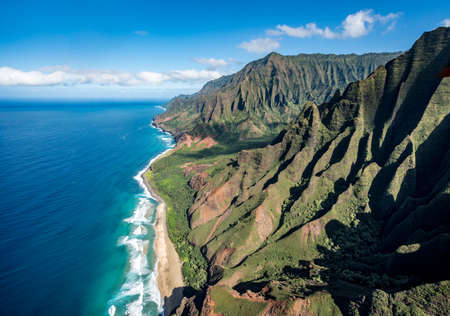 Aerial view of Na Pali coastline and Kalalau beach on hawaiian island of Kauai from helicopter flightの写真素材