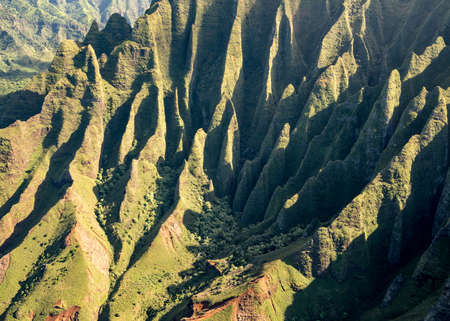 Aerial view of Na Pali mountains and landscape of hawaiian island of Kauai from helicopter flightの写真素材