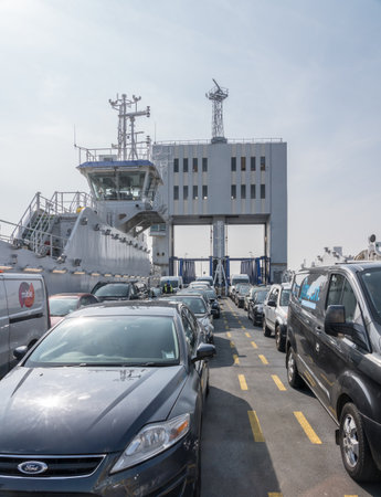 LONDON, UK - 15 APRIL 2018: Cars onboard the free Woolwich Ferry across the Thames in London