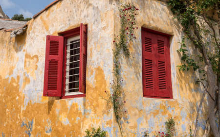 Small window in ancient neighborhood of Anafiotika in Athens by the Acropolisの写真素材