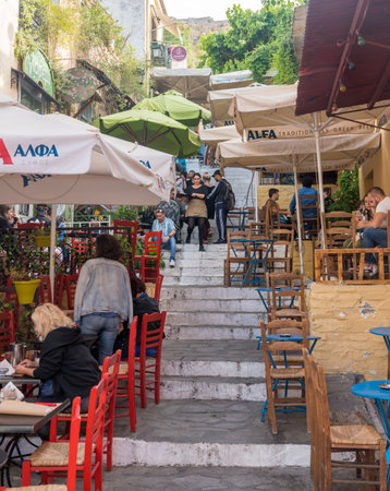 ATHENS, GREECE - 14 May 2019: Busy Taverna on steps in ancient neighborhood of Plaka in Athens by the Acropolisのeditorial素材