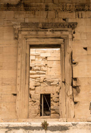 Ancient stone doorway into the Erechtheion or Erechtheum temple in Acropolisの写真素材