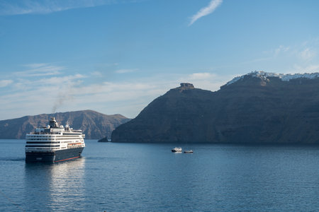 SANTORINI, GREECE - 18 MAY 2019: Holland America Line Veendam bringing tourists to island of Santoriniのeditorial素材
