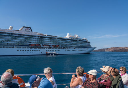SANTORINI, GREECE - 18 MAY 2019: Tender ferry boats bringing cruise passengers to island of Santoriniのeditorial素材