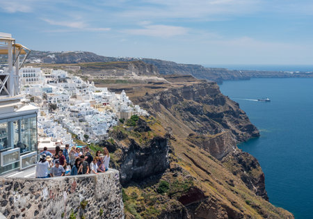 SANTORINI, GREECE - 18 MAY 2019: Crowded street on cliff in village of Fira on Santoriniのeditorial素材