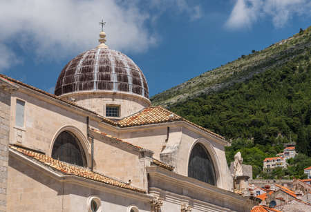 Statues and dome on St Blaise church in the old town of Dubrovnik in Croatiaの写真素材