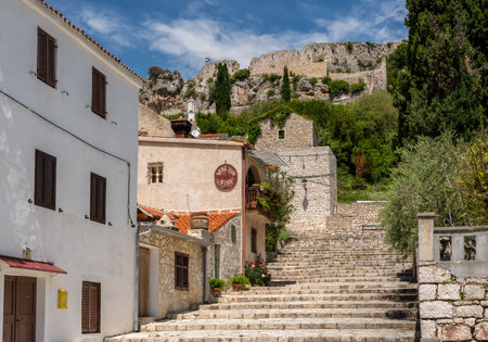 Novigrad, Croatia - 23 May 2019: Local tavern on steps leading to fortress on hilltop in the coastal town of Novigrad in Croatiaのeditorial素材