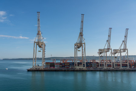 Koper, Slovenia - 24 May 2019: Cranes line the quayside of the container port of Koper in Slovenia