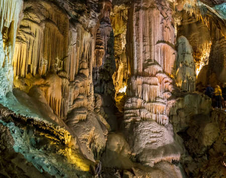 Stalactites and stalagmites underground in cave system in Postojnaの写真素材