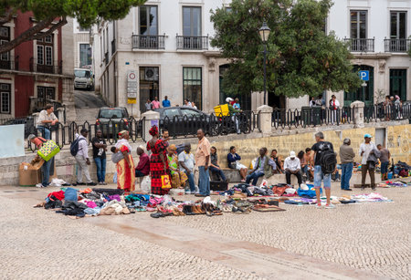 Lisbon, Portugal - 8 August 2019: Immigrants at a street market or jumble sale in downtown Lisbonのeditorial素材