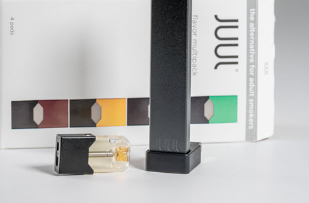 Morgantown, WV - 11 September 2019: Juul e-cigarette and nicotine vaping JuulPod on white backgroundのeditorial素材