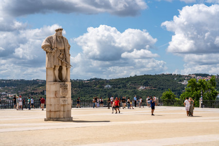 Coimbra, Portugal - 11 August 2019: Tourists visiting the main square wiht statue of King Joao of the University of Coimbraのeditorial素材