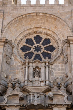 Stone carvings and window above main entrance to the old Cathedral or Se in Portoの写真素材
