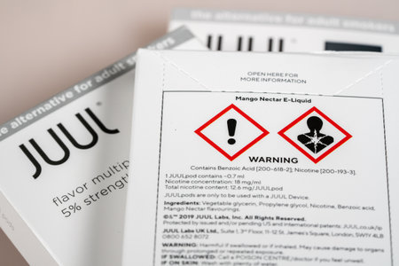 MORGANTOWN, WV - 12 October 2109: Warning sign for Juul e-cigarette or nicotine vapor dispenser box...