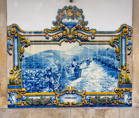 Pinhao, Portugal - 13 August 2019: Glazed tiles by J. Oliveira, depicting the Douro region and Port wine making activities.のeditorial素材