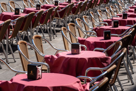 Salamanca, Spain - 15 August 2019: Tables and chairs of outdoor cafe in Plaza Mayor in Salamancaのeditorial素材
