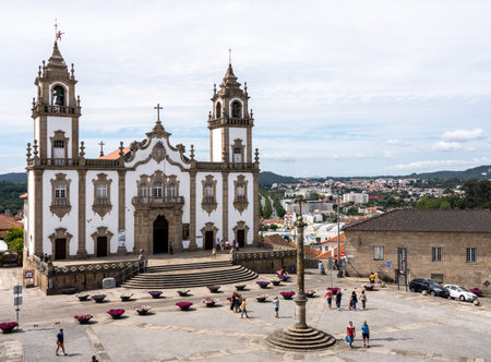 Viseu, Portugal - 19 August 2019: Main square in the old town of Viseu with the Misericordia church and stone crossのeditorial素材
