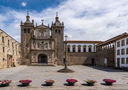 Main cathedral or Se in Viseu with stone cross and large empty square