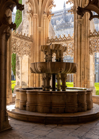 Leiria, Portugal - 20 August 2019: Ornate fountain by the cloisters at the Batalha Monastery near Leiria in Portugalのeditorial素材