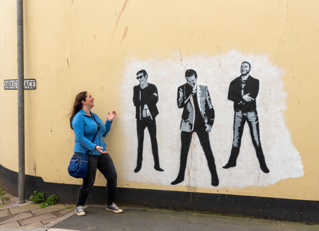 Teignmouth, Devon - 28 September 2019: Restored mural of the group Muse by Mos Shaw on a wall in Teignmouthのeditorial素材