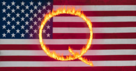 Concept fire or flames background illustration for QAnon or Q Anon, a deep state conspiracy theory set against USA flagの写真素材