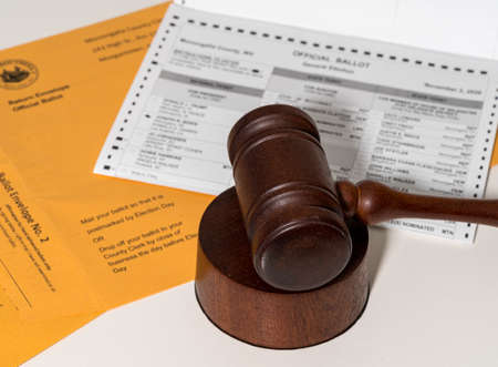Concept for problems in deciding Presidential election in the USA with judges gavel on absentee...