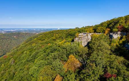 Aerial drone image of the Coopers Rock state park overlook over the Cheat River in narrow wooded...