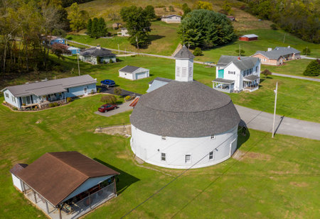 Mannington WV - 3 October 2020: Aerial view of well preserved white wooden round barn with cupola in Mannington, West Virginiaのeditorial素材