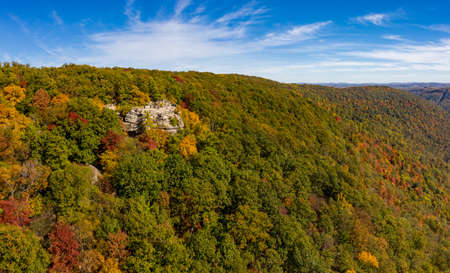 Aerial drone image of the Coopers Rock state park overlook over the Cheat River in narrow wooded...