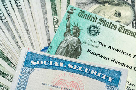 Illustration of the 2021 federal stimulus check from the IRS with cash and social security cardの写真素材