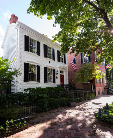 Washington DC - 13 August 2013: Typical Georgetown Washington DC street scene on O Street NW with white painted house with flagのeditorial素材