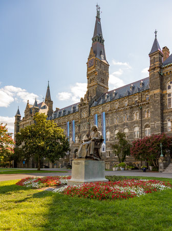 Washington DC - 13 August 2013: Statue of John Carroll in front of Healy Hall the historic flagship building of Georgetown Universityのeditorial素材