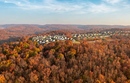 Late sun casts warm light on the The Bluffs residential development in Falling Water near Morgantown West Virginia on a beautiful autumn dayの写真素材