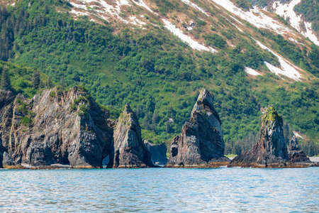 Dramatic rocky outcrops in Resurrection Bay near the port of Seward in Alaskaの写真素材