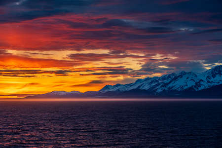 Late evening sunset on panorama of mountains and Mount Fairweather by Glacier Bay National Park in Alaskaの写真素材