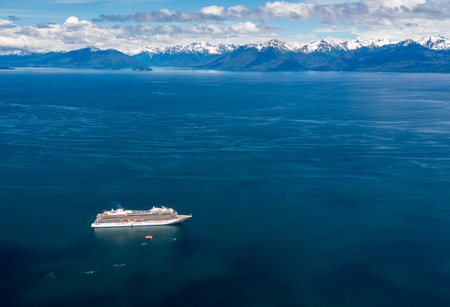 Hoonah, AK - 7 June 2022: Viking Orion cruise ship anchored at Icy Strait Point Alaska with...